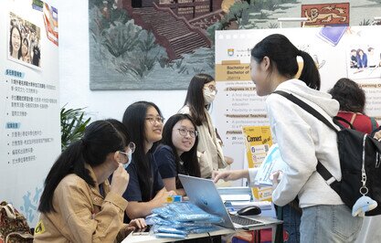 three student chatting and smiling