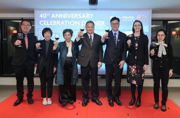 a group photo of people toasting