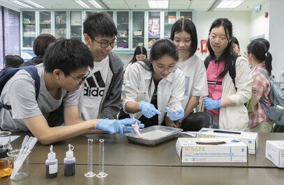 Participants carry out experiments during the STEM workshop.