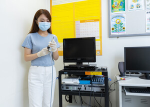 A student holding the endoscope