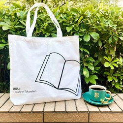 a white bag and a coffee cup