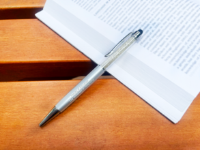 a pen and a book