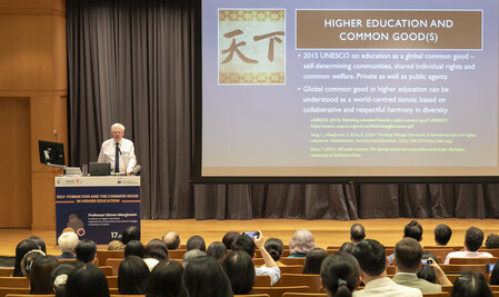 a speaker stands by the lectern and conducts a presentation