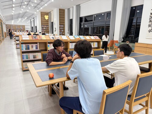 Students discussing in a library